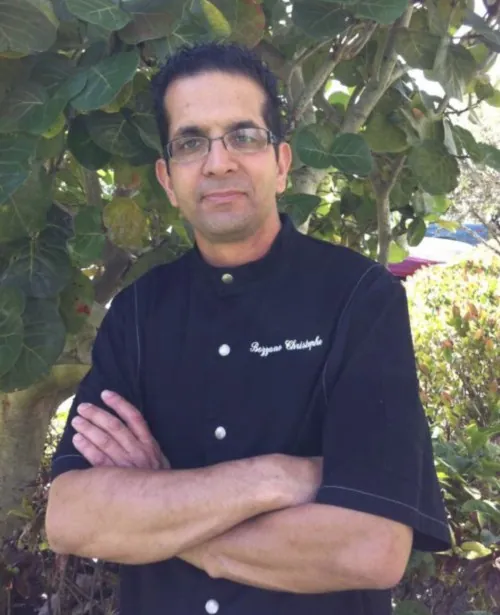 Chef Christophe Bozzano in his chef coat outside the shop